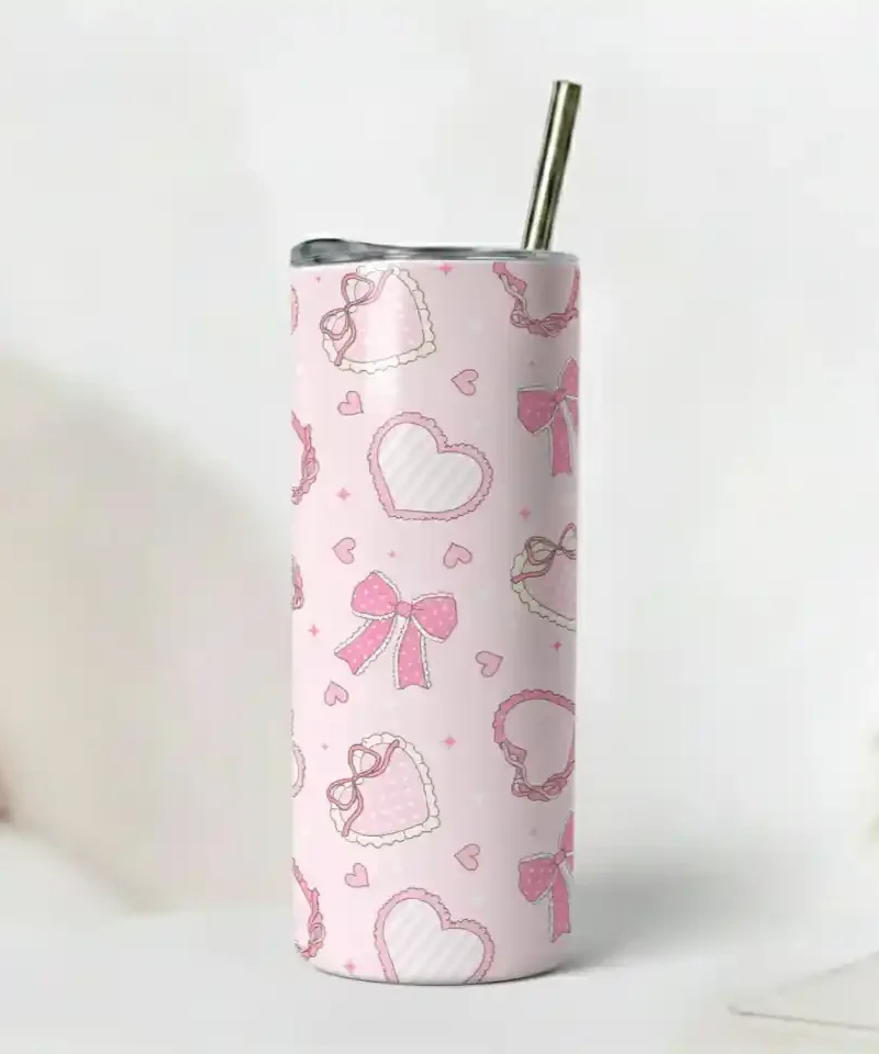 Kawaii Pink Love Tumbler with repeating bows and hearts on a pale pink glossy surface