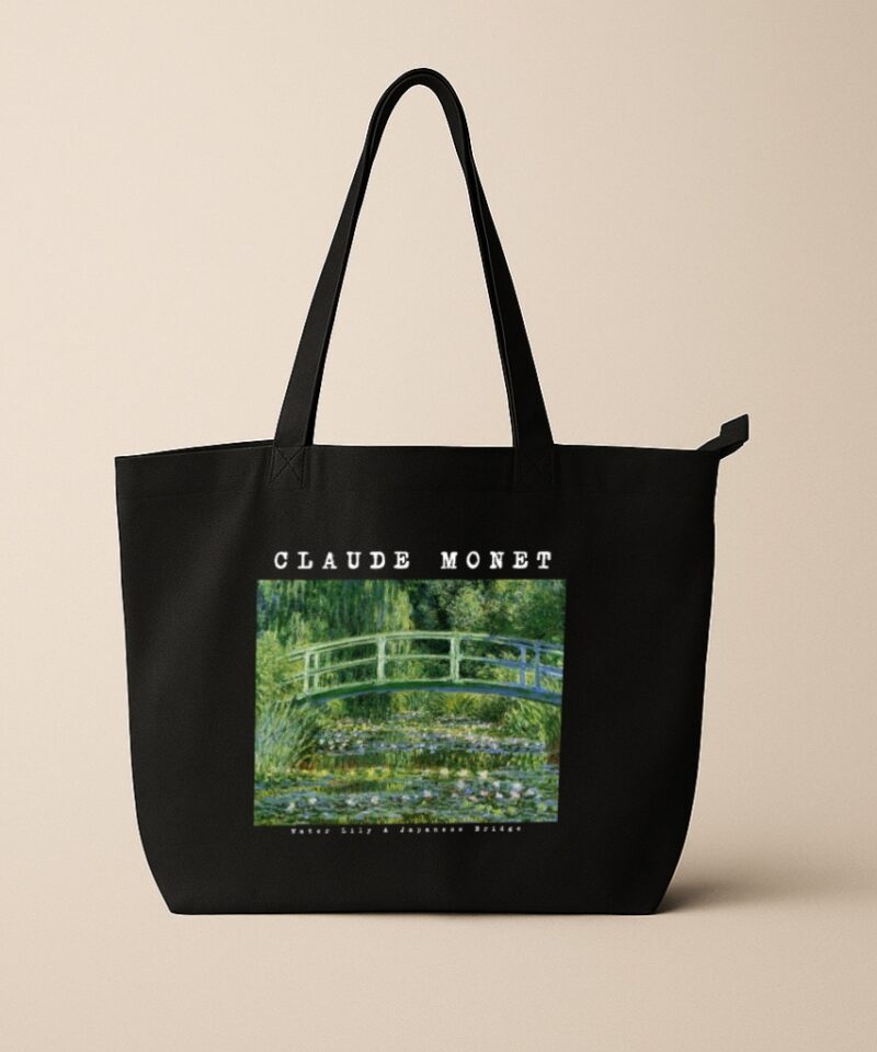 Black tote bag featuring Claude Monet’s Water Lily & Japanese Bridge painting with artist name and title text.