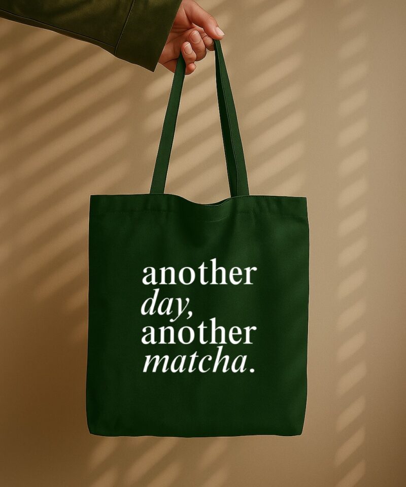 Bottle-green tote bag with “Another Day Another Matcha” typography design.