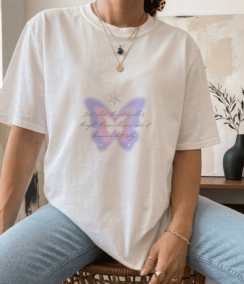 Front view of Aura Butterfly Oversized T-Shirt in soft pink and purple butterfly design, made with 240 GSM premium cotton.